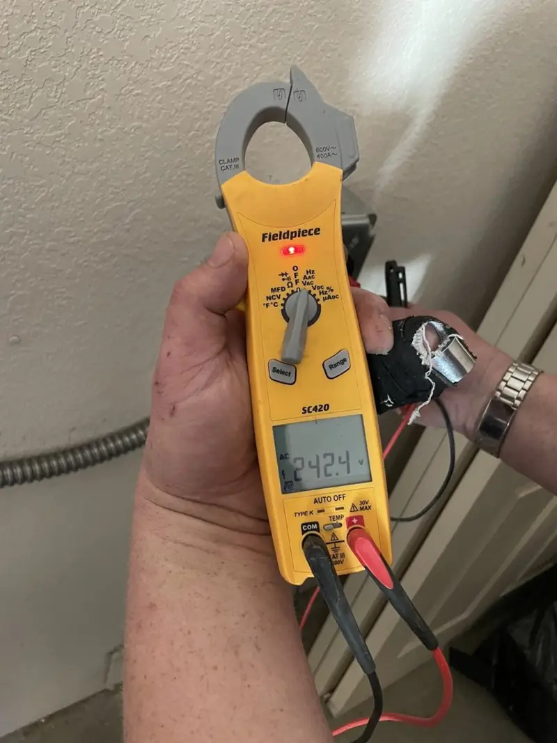 Voltage testing with clamp meter during Circuit Breaker Repair in Golf Manor